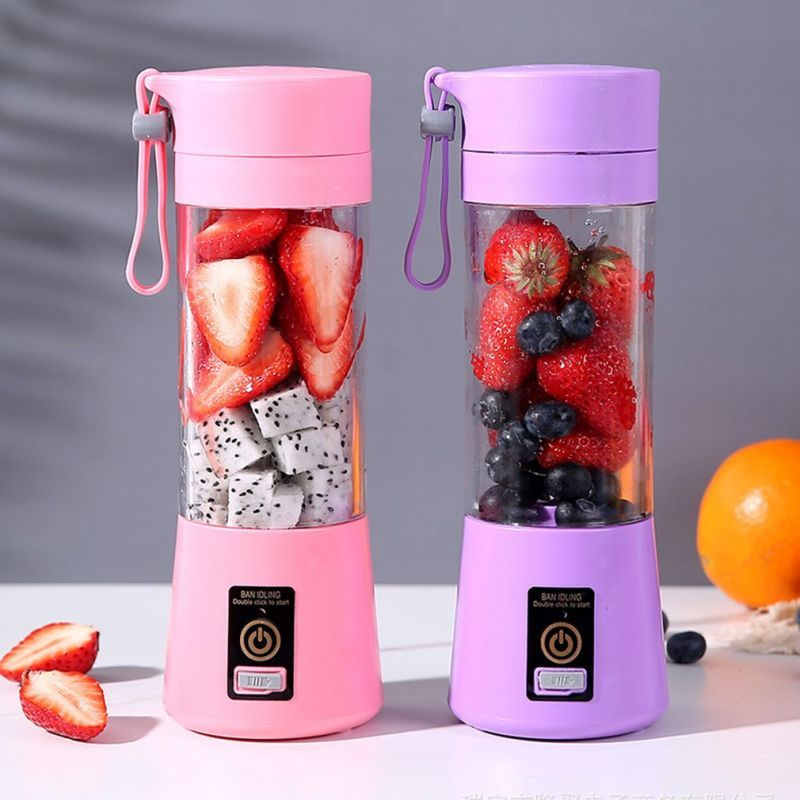 Portable mini juicers with fruit, pink and purple rechargeable blenders on table