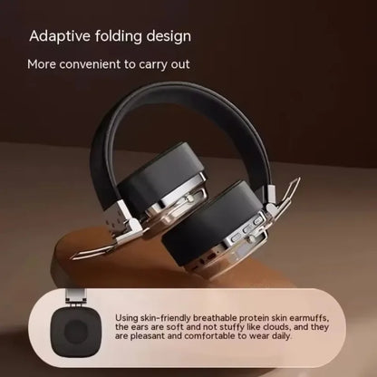 Foldable black and silver wireless headphones with protein skin earmuffs on brown background